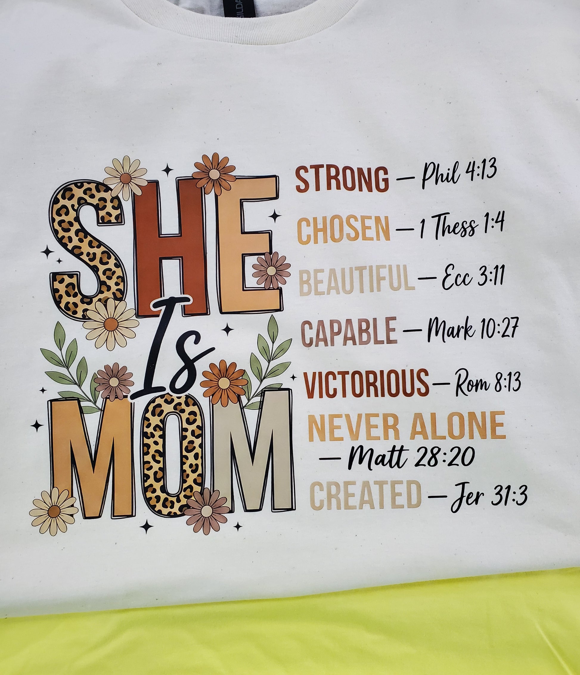 Shirt with 'She is Mom' text and motivational quotes 